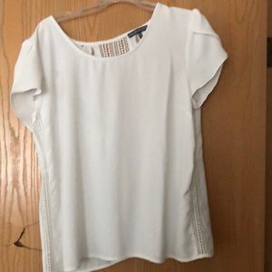 Beautiful white blouse with detailed back.